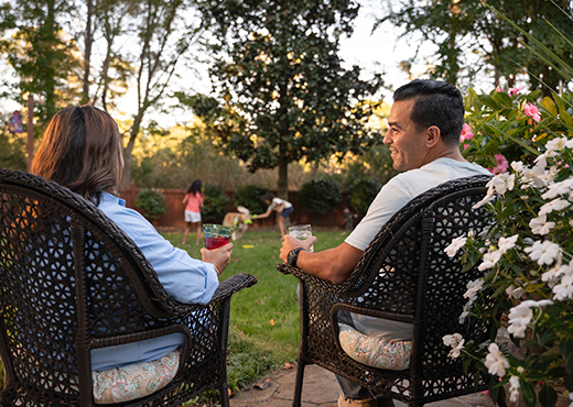  Couple sitting in the backyard.