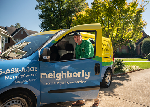 Mosquito Joe professional getting out of company van.